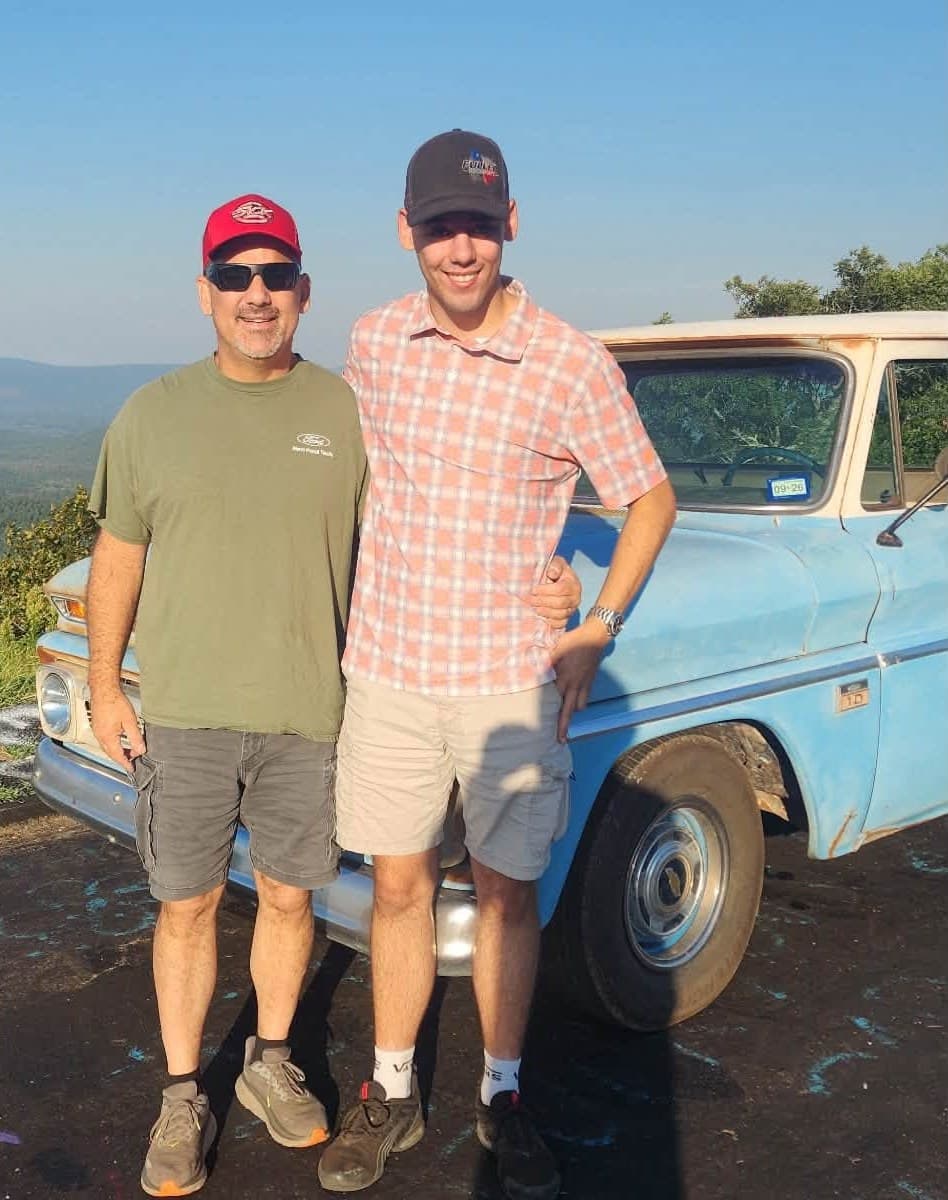 Randy and Ty Fuller, the new owners of Arlington Automotive Machine Shop, in front of a classic Chevrolet pickup