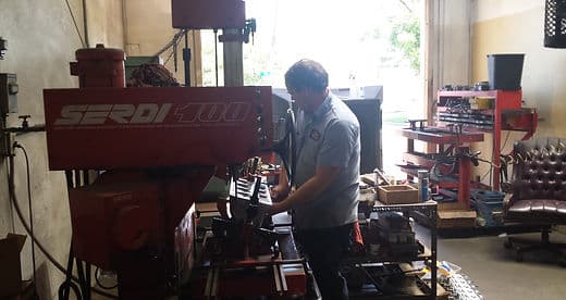 A machinist at work on the Arlington Automotive Machine Shop floor