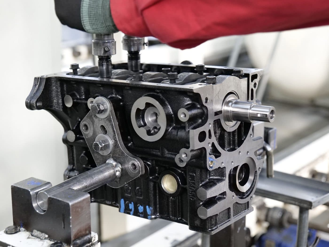 An engine block on the bench during teardown and cleaning